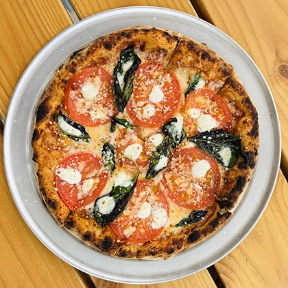 A delicious pizza from Pueblo Pizza at Eddie's Food & Drink in San Luis.