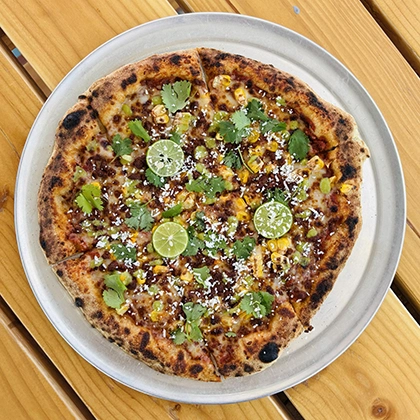 A pizza from Pueblo Pizza at Eddie's Food & Drink in San Luis.